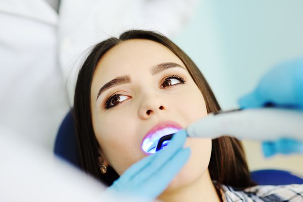 Woman getting her teeth whitened