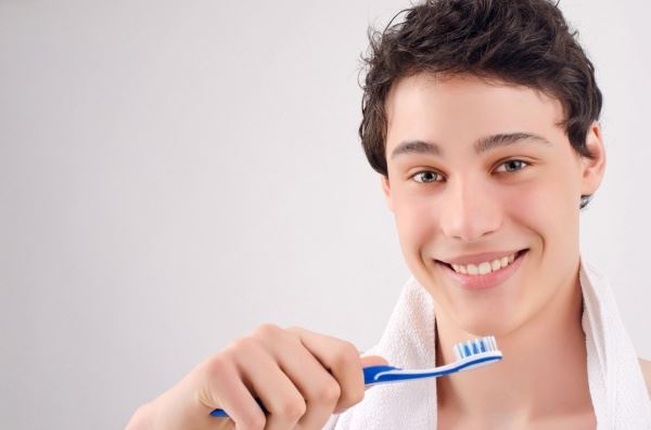 Boy brushing his teeth