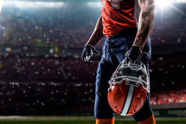 Man holding a football helmet