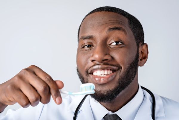 Dentist brushing teeth